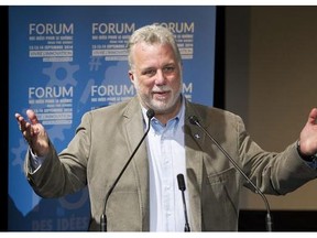 Quebec Premier Philippe Couillard speaks during a Quebec Liberal Party 'Forum on Ideas' in St-Lambert on Sunday.