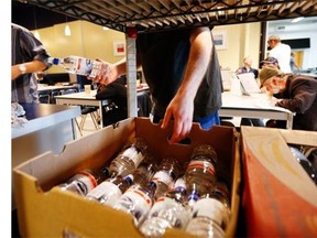 Workers at the Old Brewery Mission restock the shelves in 2013.