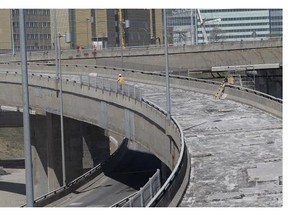 A worker walks on a Turcot Interchange ramp under construction in May 2013. Transport Quebec now publishes a list of weekend highway work by the end of each workweek, to help people plan their travel.