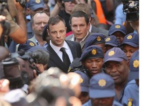 Oscar Pistorius leaves on bail from the North Gauteng High Court on September 12, 2014 in Pretoria, South Africa.