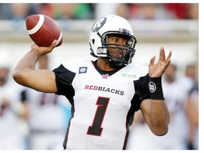 Ottawa Redblacks quarterback Henry Burris rears back to make a pass against the Montreal Alouettes in the first half of a pre-season CFL game at Molson Stadium in Montreal, on Friday, June 19, 2014.