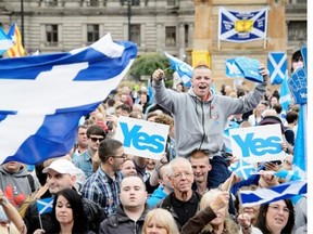 People gather for a pro-independence rally in Glasgow’s George Square, in Scotland, on September 17, 2014, ahead of the referendum on Scotland’s independence.