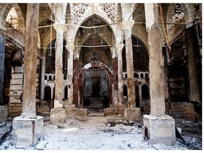 A picture taken on August 18, 2013 shows the Amir Tadros Church in Minya, some 250 kms south of Cairo, which was set ablaze on August 14, 2013. Egypt’s Christians are living in fear after a string of attacks against churches, businesses and homes they say were carried out by angry supporters of ousted Islamist president Mohamed Morsi. As police dispersed Morsi supporters from two Cairo squares on August 14, attackers torched churches across the country in an apparent response.