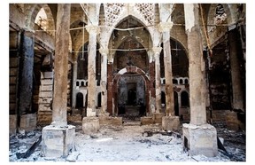 A picture taken on August 18, 2013 shows the Amir Tadros Church in Minya, some 250 kms south of Cairo, which was set ablaze on August 14, 2013. Egypt’s Christians are living in fear after a string of attacks against churches, businesses and homes they say were carried out by angry supporters of ousted Islamist president Mohamed Morsi. As police dispersed Morsi supporters from two Cairo squares on August 14, attackers torched churches across the country in an apparent response.