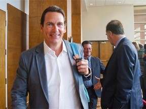 PQ MNA Pierre-Karl Peladeau arrives at the opening of a two-day caucus meeting Wednesday, August 27, 2014 in Quebec City.