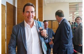 PQ MNA Pierre-Karl Peladeau arrives at the opening of a two-day caucus meeting Wednesday, August 27, 2014 in Quebec City.