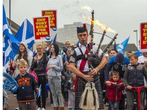 Piper Ryan Randall leads a pro-Scottish independence rally in the suburbs of Edinburgh on September 18, 2014, during Scotland’s independence referendum. Scotland is voting on Thursday in an independence referendum that could break up the centuries-old United Kingdom and create Europe’s newest state since the collapse of Yugoslavia.