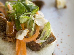 Kyozon's menu features New-Asian food such as these pork belly steamed buns. (Photo by Georges Alexandar)