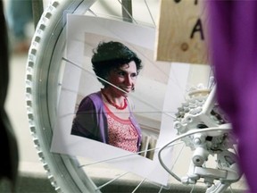 A portrait of Mathilde Blais is seen in he spokes of a “ghost bike” during a memorial vigil on St. Denis St. at the St. Denis St. underpass in Montreal Monday, May 5, 2014. Blais was killed a week ago when her bike collided with a truck.
