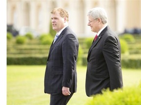 Prime Minister Stephen Harper walks through the gardens of the Constantine Palace with Foreign Affairs Minister John Baird (left) Thursday September 5, 2013 in St. Petersburg, Russia prior to the G20 Summit.