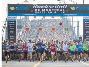 Runners depart from the starting line on the Jacques-Cartier bridge for the 24th Montreal Marathon in Montreal on Sunday, September 28, 2014.