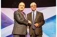 Scotland’s First Minister Alex Salmond (L) and leader of the Better Together campaign and former minister Alistair Darling (R) shake hands ahead of the STV live television debate on Scottish independence in Glasgow, Scotland on August 5, 2014.