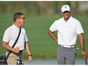 “Am I looking for a new coach? As of right now, no, I’m not,” Tiger Woods says, after firing his swing coach, Sean Foley, left, last month.  “Right now I’m just trying to get physically better, stronger, faster, more explosive."