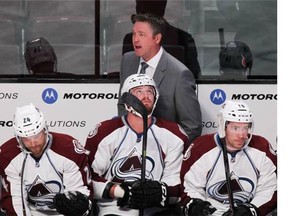 Colorado Avalanche coach Patrick Roy talks to linesman during National Hockey League pre-season game against the Canadiens in Montreal Thursday September 25, 2014.
