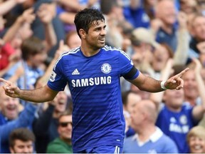 Chelsea’s Diego Costa celebrates scoring his side's third goal against Swansea City during their English Premier League soccer match at Stamford Bridge, London, on Saturday.