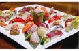 The sushi and sashimi platter for two, with pretty maki rolls, is a colourful, artistic arrangement.