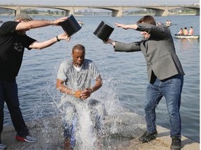 Two-time Grammy award winning rapper and a founding member of the Fugees, Pras Michel, gets doused by his friends for the ALS Ice Bucket Challenge, Sunday, Aug. 31, 2014 in Pyongyang, North Korea. The American rapper and documentary filmmaker said he wanted to join in the immensely popular charity challenge and thought of Pyongyang where the ice bucket craze is unknown, would be the perfect place to do it.