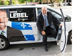 Tory MP Denis Lebel arrives in his marked van to address supporters in Montreal. A pre-electoral push by the federal Conservatives is underway in Quebec to charm Quebecers even though the next election could be more than a year away. Lebel is trying to woo a province where the party holds just five seats and polls have often suggested it sits fourth in popular support.