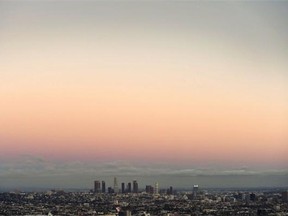Twilight view of the downtown district of Los Angeles taken from the Hollywood Hills on September 18, 2014.
