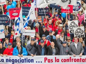 Union leaders march with protesters down Berri St. in a demonstration against pension reform proposed in Bill 3 in Montreal on Saturday.