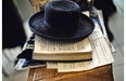 View of a hat and the Torah of a members of an ultra-Orthodox Lev Tahor Jewish group at the building where the group will remain in Guatemala City on September 2, 2014. Some 230 ultra-Orthodox Lev Tahor Jews were expelled from the town of San Juan La Laguna by Mayan indigenous leaders.