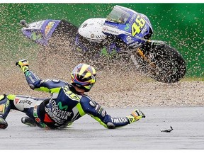 Yamaha rider Valentino Rossi, of Italy, crashes during a first free practice session for Sunday's San Marino Moto GP grand prix at the Misano circuit in Misano Adriatico, Italy, Friday, Sept. 12, 2014.