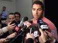 Francis Bouillon speaks with members of the media at the Bell Sports Complex in Brossard on Monday, Oct. 6, 2014, after it was announced that he was cut from the Montreal Canadiens.