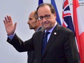 French President François Hollande arrives to attend the 10th Asia-Europe Meeting (ASEM) on Oct. 16, 2014, in Milan.