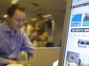 Workers prepare the Montreal Gazette for its Tuesday October 21, 2014 relaunch of its 4 products- web, mobile, tablet, and print.