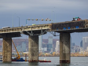 A view of part the Champlain Bridge under repairs with the Montreal skyline in the background on Oct. 15, 2014.