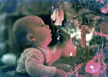 Sam, 5 mths old in his walker amazed by the lights..