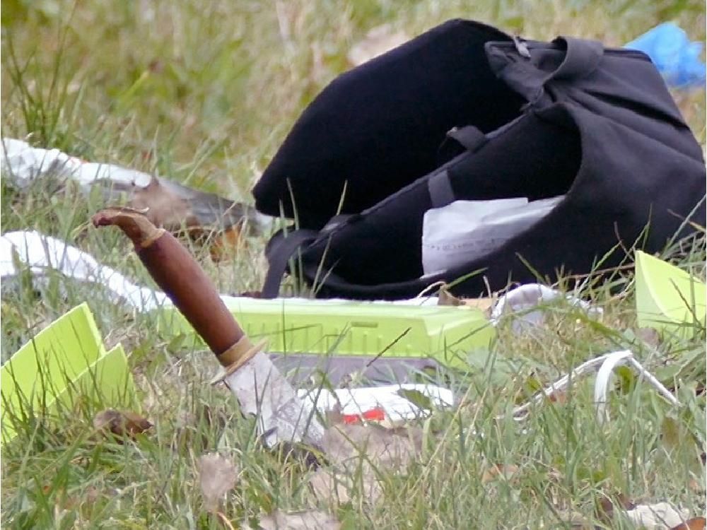 Attack On Soldiers An Act Of Violence Against Canada Quebec Public   A Knife Stuck In The Ground Near An Overturned Car Is Pictur 