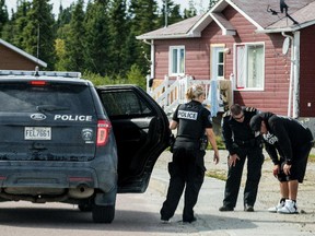 Police deal with a situation in the First Nations reserve of Opitciwan, 600 kilometres north of Montreal, on Sunday, Sept. 1, 2013.