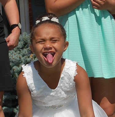 even flower girl Amiah took time for  a silly funny face.