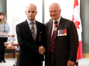 Andrei Odorico and Governor General David Johnston during medals ceremony  in Quebec City.