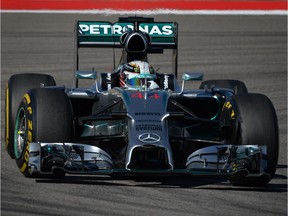 Mercedes driver Lewis Hamilton steers his F1 car to the fastest time during the second practice session for the United States Grand Prix at the Circuit of The Americas in Austin, Tex., on Oct. 31, 2014.