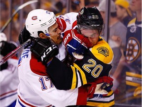 The Bruins' Daniel Paille and the Canadiens' Rene Bourque get into a scuffle during Game 2 of their second-round playoff series at Boston's TD Garden on May 3, 2014.