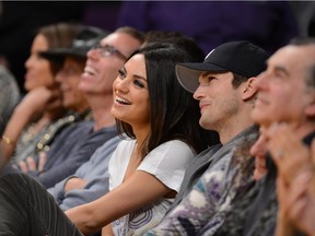 Actors Ashton Kutcher  and Mila Kunis back when they had only one child.