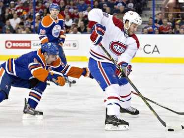 Montreal Canadiens' Brandon Prust is chased by Edmonton Oilers' Jordan Eberle during first- period action in Edmonton on Monday, Oct. 27, 2014.