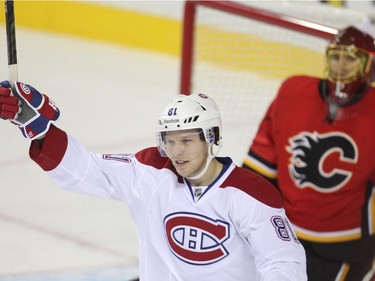 Lars Eller raises his stick after the Habs scored in Calgary Tuesday, Oct. 28, 2014.
