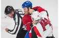 Canadiens’ Brandon Prust exchanges punches with Senators defenceman Mark Borowiecki during the first period their preseason NHL hockey match at the Bell Centre in Montreal on Saturday, October 4, 2014.