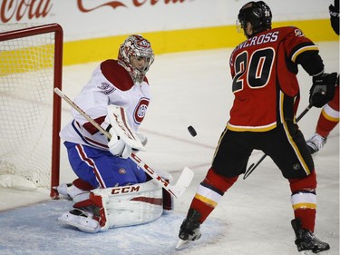 Habs goalie Carey Price blocks a shot from Calgary Flames' Curtis Glencross during first- period action in Calgary, Tuesday, Oct. 28, 2014.