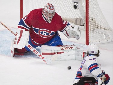 Montreal Canadiens goaltender Carey Price makes a save against New York Rangers' Mats Zuccarello during first period NHL hockey action in Montreal, Saturday, October 25, 2014.