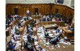 Montreal Mayor Denis Coderre, standing, speaks during a City Council meeting in a room littered with papers from an earlier protest by the firefighter's union at Montreal city hall in Montreal on Monday, August 18, 2014. Four  Montreal police commanders have been suspended without pay for their inaction during the incident . (Dario Ayala / THE GAZETTE)