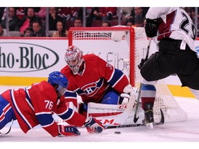 P.K. Subban helps Carey Price stop the puck on an attempt by Nathan MacKinnon of the Avalanche at the Bell Centre on Oct. 18, 2014 in Montreal.