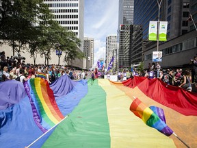 Revellers take part in the 2012 Gay Pride Parade in downtown Montreal on Sunday, Aug. 19, 2012.
