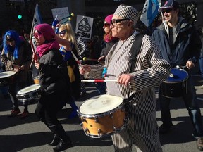 Costumed drummers at the anti-austerity demo outside Quebec Premier Philippe Couillard's office, Friday, Oct. 31, 2014.