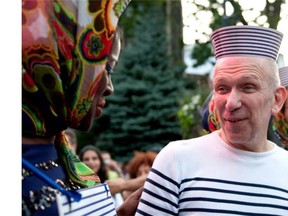 Designer Jean Paul Gaultier talks to Christelle Germelus after cutting the ribbon to mark the beginning of the Pinkarnaval parade on Ste-Catherine St. in Montreal on July 16, 2011.