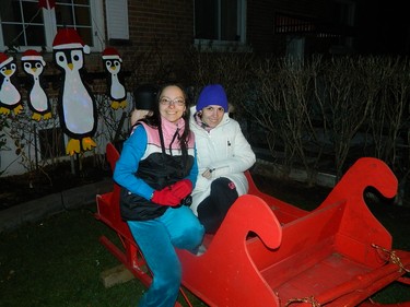 Me and my sister in a sled that our family made. Merry Christmas