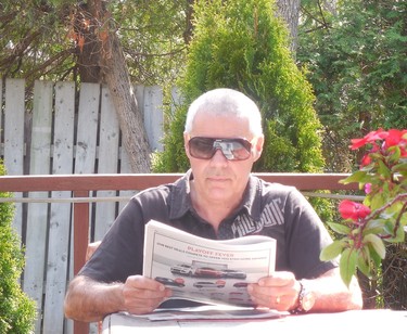 Yours truly reading the Gazette on the patio.